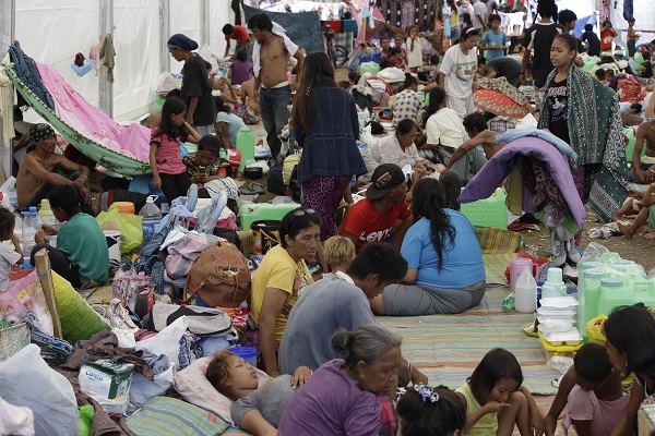 Villagers, who were displaced by the fighting between government forces and Muslim rebels in Zamboanga City, continue to be housed in tents in a stadium Friday, Sept. 20, 2013. The United Nations warned Wednesday, Sept. 25, that Zamboanga faces a humanitarian crisis, with tens of thousands of people uprooted by a wave of deadly violence.  AP PHOTO/BULLIT MARQUEZ 
