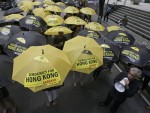 Protesters, led by Congressman Walden Bello, bottom right, open their yellow and black umbrellas outside the Chinese Consulate at the financial district of Makati city east of Manila, Philippines Thursday, Oct. 2, 2014 to express their solidarity with the pro-democracy protest in Hong Kong which some sectors dubbed as "Umbrella Revolution." AP FILE PHOTO