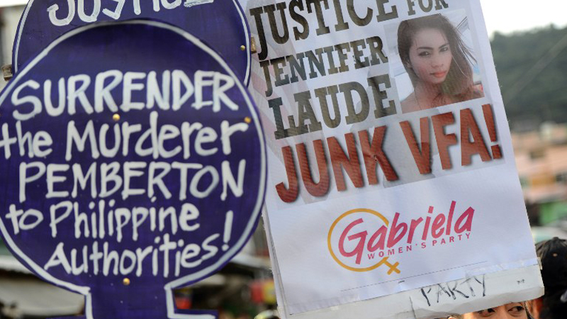 Members of Gabriela Women’s Party demand justice for slain transgender woman Jeffrey “Jennifer” Laude during Tuesday’s rally outside the Hall of Justice in Olongapo City. AFP PHOTO/NOEL CELIS