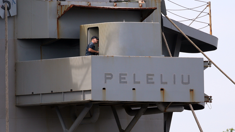 In this Oct. 17, 2014, photo, a US marine walks inside the USS Peleliu, where US Marine Pfc. Joseph Scott Pemberton was said to be detained after allegedly killing Filipino transgender Jeffrey “Jennifer” Laude at the Subic Bay free port, Zambales province. Nine US Navy ships scheduled to arrive in Subic in November until December have decided to cancel their port calls due to “anti-American sentiments” in the country after Pemberton was implicated in the slaying of Laude, a group of business owners said.  AP PHOTO/AARON FAVILA 