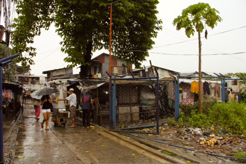 Entrance to the San Roque informal settlement in Quezon City's North Triangle. Many of Navarra's students live here.  PHOTOS BY AURORA ALMENDRAL