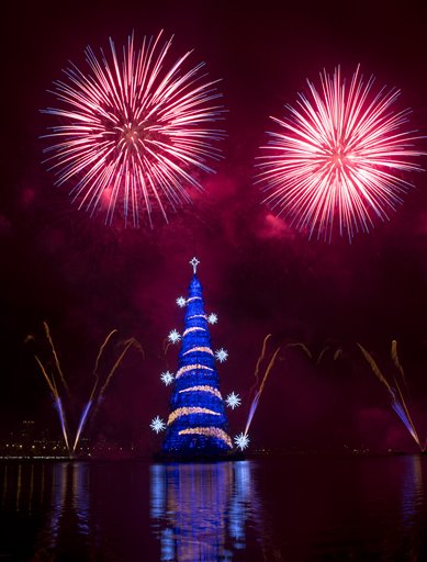 Fireworks explode over the floating Christmas tree in Lagoa lake at the annual holiday tree lighting event in Rio de Janeiro, Brazil, Saturday, Nov. 29, 2014. AP