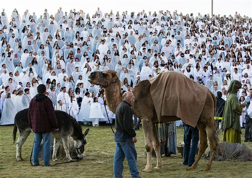 In this photo taken on Monday, Dec. 1, 2014, more than 1,000 participants gather at Rock Canyon Park in Provo, Utah, in an attempt to set a world record for the largest recreation of a live Nativity scene. AP