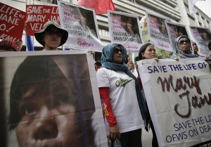 Protesters display placards during a rally at the Indonesian Embassy in the financial district of Makati city, east of Manila, Philippines, to appeal to the Indonesian government to spare the life of convicted Filipino drug trafficker Mary Jane Veloso Friday, April 24, 2015. Filipino maid Veloso along with eight other foreign nationals and an Indonesian were sentenced to death by firing squad for illegally trafficking drugs into Indonesia in 2010. The protest came at a time as Veloso and the other convicts were transferred Friday to Nusakambangan prison island awaiting possible execution next week. AP