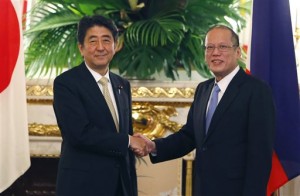 Philippine President Benigno Aquino III, right, shakes hands with Japanese Prime Minister Shinzo Abe prior to their meeting at Akasaka Palace state guesthouse in Tokyo Thursday, June 4, 2015. Japan and the Philippines are set to begin discussing exporting Japanese military hardware to the Philippines, possibly anti-submarine reconnaissance aircraft and radar technology, amid increasingly assertive Chinese activity in regional seas. AP Photo/Shizuo Kambayashi, Pool