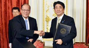 President Aquino, left, and Japan's Prime Minister Shinzo Abe shake hands during a signing ceremony after their meeting at the Akasaka Palace state guesthouse in Tokyo on Thursday, June 4, 2015. Under the strategic partnership agreement signed Thursday between Aquino and his Japanese host Abe, the two countries will begin military equipment transfer talks that may include anti-submarine reconnaissance aircraft and radar technology. KAZUHIRO NOGI/POOL PHOTO VIA AP