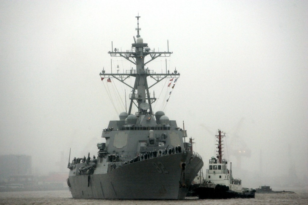 In this April 8, 2008, file photo, guided missile destroyer USS Lassen arrives at the Shanghai International Passenger Quay in Shanghai, China, for a scheduled port visit. The USS Lassen has sailed past one of China's artificial islands in the South China Sea on Tuesday, Oct. 27, 2015, in a challenge to Chinese sovereignty claims that drew an angry protest from Beijing, which said the move damaged US-China relations and regional peace. (AP Photo/Eugene Hoshiko, File)