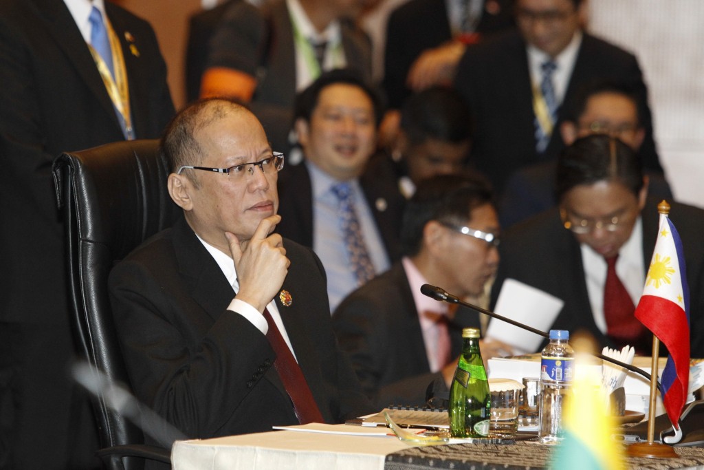 Philippines' President Benigno Aquino III listens during the 27th Association of Southeast Asian Nations (ASEAN) summit in Kuala Lumpur, Malaysia, Saturday, Nov. 21, 2015. (AP Photo/Joshua Paul)