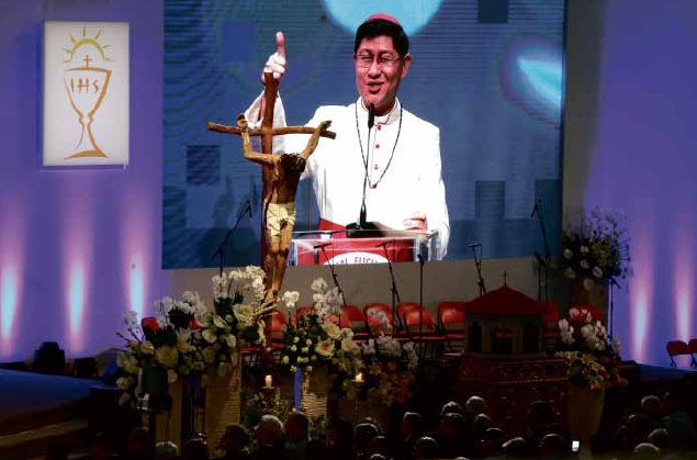 THUMBS UP Manila Archbishop Luis Antonio Cardinal Tagle speaks before 15,000 delegates on the fourth day of the International Eucharistic Congress in Cebu City. MARIANNE BERMUDEZ