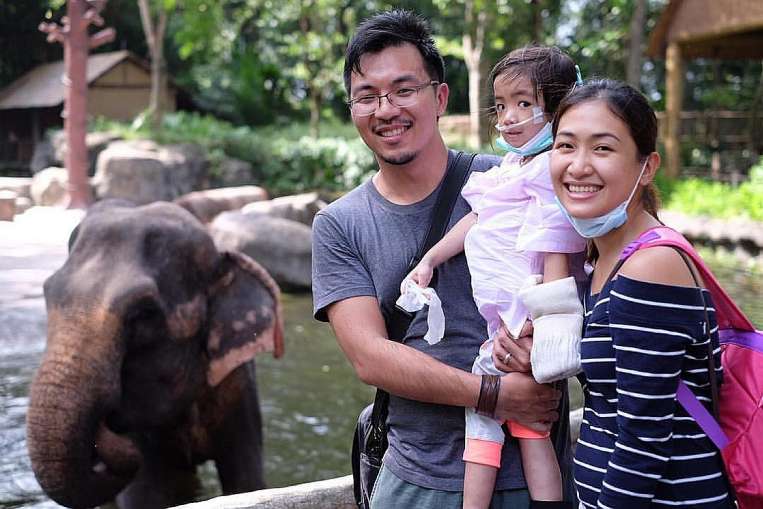 Caitlin visited the zoo with her parents last Thursday after being allowed out of the hospital for an afternoon. Her illness first surfaced as insect bites on her ankle last September. PHOTO: COURTESY OF JERICHO JOSE LUCAS/THE STRAITS TIMES