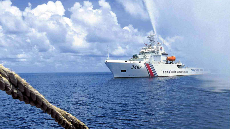 SEA DISPUTE In this photo taken on Sept. 23, 2015, a Chinese Coast Guard vessel fires its water cannon on Filipino fishermen in a confrontation off Scarborough Shoal in the West Philippine Sea. A UN court is expected to issue a ruling today on a complaint filed by the Philippines questioning China’s territorial claim over almost all of the sea, including its reefs, shoals and islets. AP
