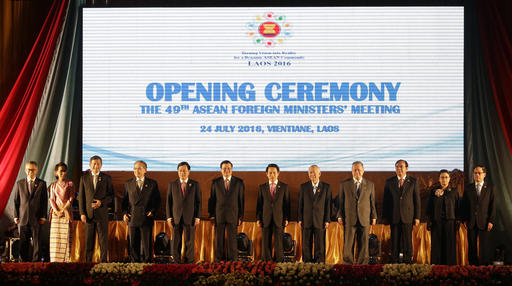 Laotian Prime Minister Thongloun Sisoulith, sixth from left, and Laotian Foreign Minister Saleumxay Kommasith, sixth from right, stand with with Southeast Asian foreign ministers, from left, an unidentified delegate from Malaysia, Aung San Suu Kyi of Myanmar, Vivian Balakrishnan of Singapore, Don Pramudwinai of Thailand, Pham Binh Minh of Vietnam, Thongloun Sisoulith, Saleumxay Kommasith, Perfecto Yasay Jr. of the Philippines, Brunei's Trade Minister Jock Seng Pehin Lim, Sakhonn Prak of Cambodia, Retno Marsudi of Indonesia and ASEAN Secretary General Le Luong Minh, as they pose for a group photo during the opening ceremony of the 49th Association of Southeast Asian Nations (ASEAN) Foreign Ministers' Meeting in Vientiane, Laos, Sunday, July 24, 2016. AP Photo