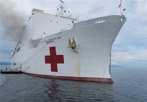 The US Navy hospital ship USNS Mercy is docked off the waters of Legazpi city in central Philippines for a medical mission Monday, July 4, 2016. Rear Admiral Brian Hurley, the commander of the US 7th Fleet Task force 73, in an interview with a select group of reporters on board the US Navy hospital ship USNS Mercy said the U.S. military is concerned about a series of attacks and abductions of tugboat crewmen by Abu Sayyaf extremists in Southeast Asian waters and is willing to lend a hand if needed as part of America's aim to ensure the freedom and safety of navigation in the region. AP PHOTO