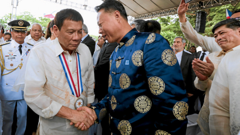 President Rodrigo R. Duterte shakes hands with Chinese Ambassador to the Philippines Zhao Jianhua KING RODRIGUEZ/PPD/FILE PHOTO