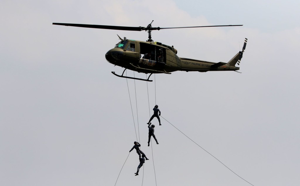 FEMALE COAST GUARD TRAINING / MARCH 16 2016 Female members of the Philippine Coast Guard's Special Operations Group conduct a rappel training emarking from flying Huey Chopper at the Coast Guard Headquarters at South Harbor Manila. INQUIRER PHOTO / RICHARD A. REYES