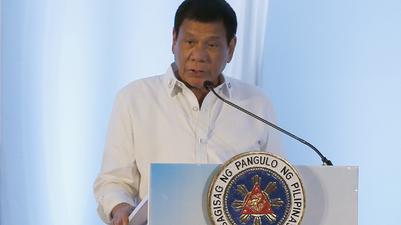 Philippine President Rodrigo Duterte addresses delegates of the ASEAN Business and Investment Summit, a parallel summit in the ongoing 28th and 29th ASEAN Summits and other related summits Tuesday, Sept. 6, 2016 in Vientiane, Laos. (AP Photo/Bullit Marquez)