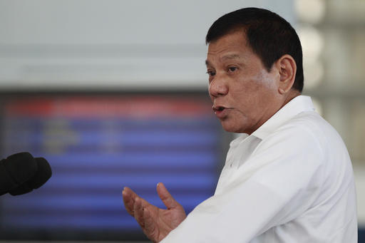 Philippine President Rodrigo Duterte gestures during his speech at Manila's International Airport, Philippines on Wednesday, Nov. 9, 2016. Duterte, who has lashed out at Barack Obama for criticizing his deadly anti-drug crackdown, congratulated U.S. President-elect Donald Trump Wednesday and said he looks forward to working with the new American leader to further enhance the treaty allies' relations. (AP Photo/Aaron Favila)