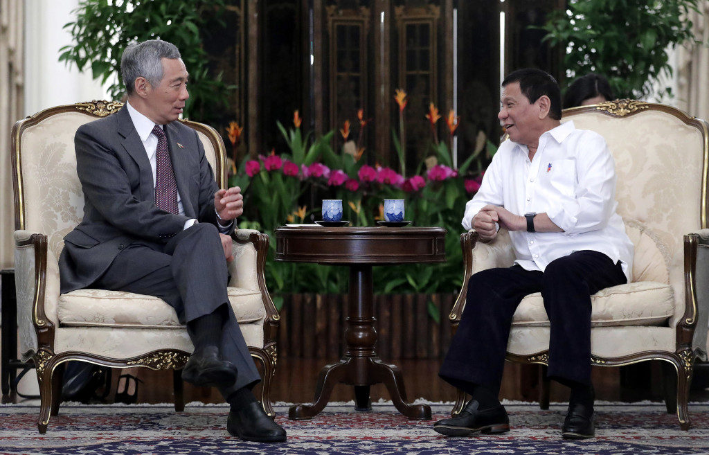 Philippine President Rodrigo Duterte, right, sits with Singapore's Prime Minister Lee Hsien Loong, at the Istana or presidential palace on Thursday, Dec. 15, 2016, in Singapore. AP 