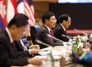 In this Aug. 4, 2015, file photo, Vietnamese Foreign Minister Pham Binh Minh, second from right, attends the Association of Southeast Asian Nations (ASEAN) Foreign Ministers Meeting plenary session in Kuala Lumpur, Malaysia. Foreign ministers from the 10 countries of the ASEAN said Saturday, Feb. 27, 2016, that they were "seriously concerned" by recent developments in the disputed South China Sea region and will seek a meeting over the issue with China. At the end of their annual retreat, held this year in the Lao capital of Vientiane, they noted their worries and reaffirmed the importance of maintaining peace, security and stability in the area. (AP Photo/Vincent Thian, File)