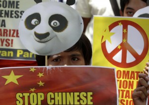 Protesters display placards during a rally outside the Chinese Consulate in Makati City on June 16to protest alleged Chinese government's military incursions into the disputed Spratly group of islands. AP