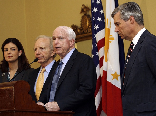 Senator John McCain, R-Ariz., second right, speaks with other Senators, from left, Kelly Ayotte, R-N.H., Joseph Lieberman, I-Conn., and Sheldon Whitehouse, D-RI, during a press conference at the US embassy in Manila Tuesday. AP