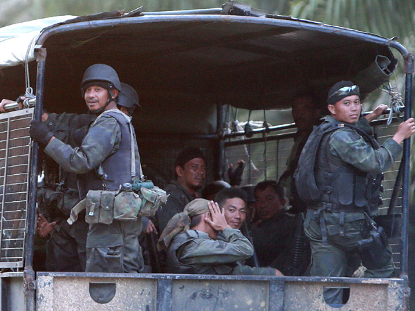 Malaysia hunts missing Filipino gunmen as more fighters join | Global News