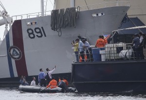 Taiwanese investigators rides a rubber boat as they inspect a ship involved in the shooting of a Taiwanese fisherman while they continue their probe in Manila on Tuesday, May 28, 2013.  AP FILE PHOTO