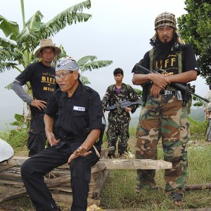 Ameril Umbra Kato, seated, the commander of Bangsamoro Islamic Freedom Fighters, is interviewed by the media inside his rebel stronghold in Maguindanao. The BIFF is said to be harboring Zulkifli bin Hir, a member of the Southeast Asian terror group Jemaah Islamiyah.  AP FILE PHOTO