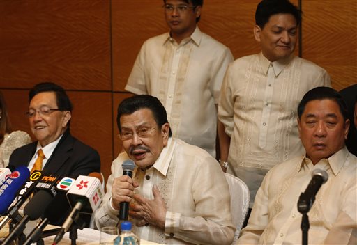 Manila Mayor Joseph Estrada speaks during a news conference in Hong Kong Wednesday. Hong Kong and the Philippines reached a compromise over Hong Kong's demands for an apology for the families of eight tourists killed in a bungled response to a 2010 Manila hostage-taking that soured relations. AP