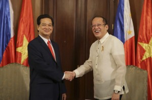 Philippine President Benigno Aquino III, right, greets Vietnamese Prime Minister Nguyen Tan Dung during his courtesy call at the Malacanang Presidential Palace in Manila, Philippines Wednesday, May 21, 2014. AP