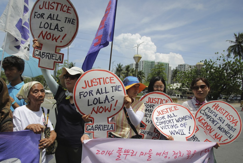  women activists join a rally in front of the Japanese Embassy in Manila, Philippines on Wednesday June 25, 2014. A group of alleged Filipino "comfort women" demanded recognition following the announcement of the affirmation of the Kono statement as a result of the Japanese government investigation on the alleged World War II sexual slavery in Korea. AP