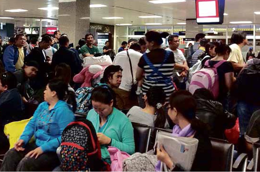 HALFWAY HOUSE After a 28-hour boat ride, Filipinos fleeing from Libya wait for their flight to Manila at Malta International Airport. CHRISTINE AVENDAÑO