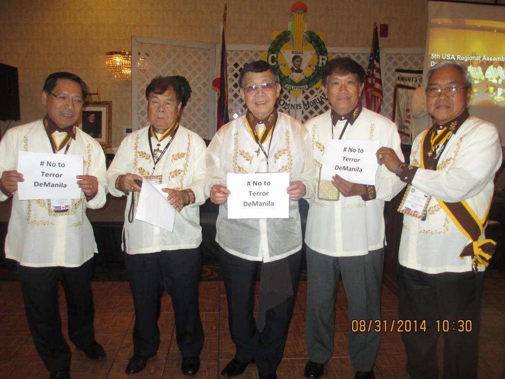 Order of Knights of Rizal officers led by Filipino American Council of Chicago president, Dr. Rufino Crisostomo (middle) show off the "Terror de Manila" signs in protest of the construction of a 46-story high-rise condo that will bloc the sight line from the Rizal Monument in Manila. PINOY photo