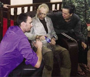 THANK ‘GOTT’ German nationals Stefan Viktor Okonek (center) and Henrike Dielen (right) rest at  a military base in Zamboanga City early Saturday hours after their release from Abu Sayyaf captivity on Friday night. AP FILE PHOTO 