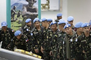 Philippine troops, who were deployed in the Golan Heights as U.N. Peacekeepers and recently battled Syrian rebels, arrive late Sunday, Sept 21, 2014 at the Ninoy Aquino International Airport at suburban Pasay city south of Manila, Philippines. Philippine President Benigno Aquino III said he's been told security threats on the Syrian side of the Golan Heights are not expected to ease soon, dimming hopes that U.N. peacekeepers can be deployed back to the region in the near future. A group of 244 Philippine peacekeepers flew back to Manila on Friday after being recalled, while 84 more arrived home Sunday, ending a five-year presence in the increasingly volatile Golan.  (AP Photo/Bullit Marquez)