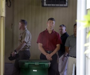 U.S. soldiers, in civilian clothes, stand outside the detention facility of U.S. soldier PFC Joseph Scott Pemberton, a suspect in the killing of Filipino transgender Jeffrey "Jennifer" Laude, after he was a flown in from the USS Peleliu Wednesday, at General Headquarters of the Philippine Armed Forces at suburban Quezon city, northeast of Manila, Philippines. Wednesday, Oct. 22, 2014. Philippine Armed Forces Chief Gen. Gregorio Pio Catapang Jr. announces on Wednesday the U.S. military turned over a Marine suspect in the gruesome killing of a transgender Filipino to the Philippine military's main camp in the capital, easing a looming irritant over his custody, officials said. (AP Photo/Bullit Marquez)