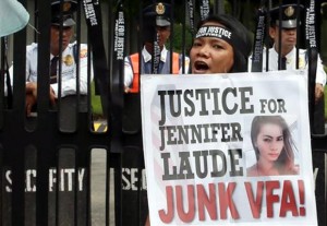 A protester shouts slogans during a rally at the Department of Foreign Affairs to demand justice in the killing of Filipino transgender Jeffrey "Jennifer" Laude with a US Marine as a possible suspect Wednesday in Pasay City. AP