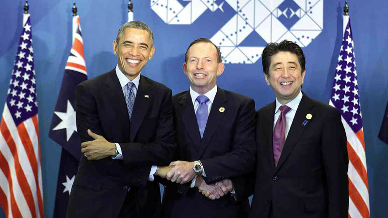 ASIA-PACIFIC COOPERATION  US President Barack Obama, Australia’s Prime Minister Tony Abbott and Japan’s Prime Minister Shinzo Abe shake hands after agreeing to strengthen their military cooperation in the Asia-Pacific region.  AFP