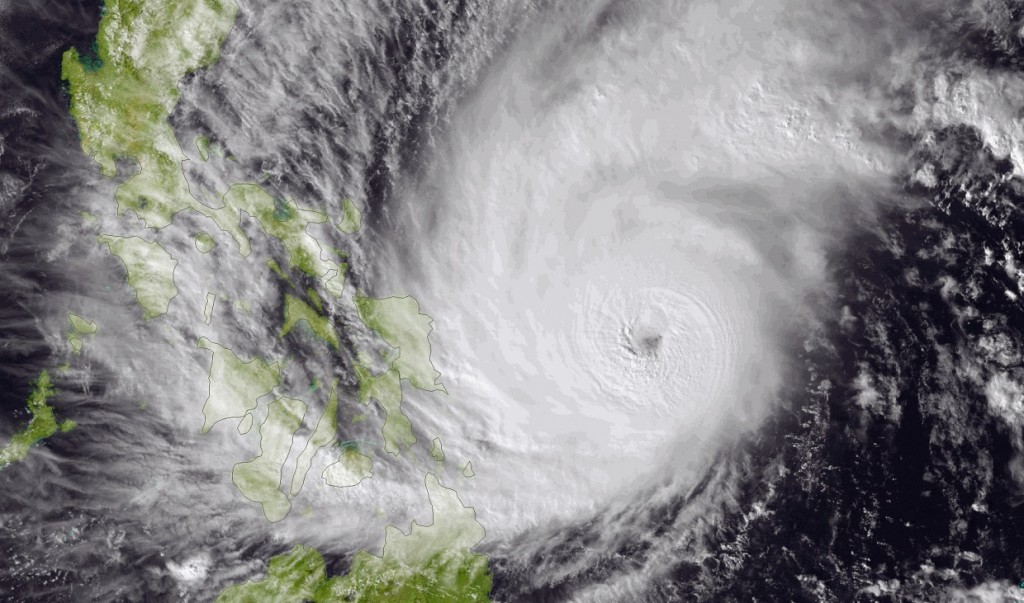 This image made available by the National Oceanic and Atmospheric Administration (NOAA) shows Typhoon Hagupit on Friday, Dec. 5, 2014, as it approaches the Philippines. The ferocious and dangerously erratic typhoon is blowing closer to the Philippines as differing forecasts about its path prompt a wide swath of the country to prepare for a weekend of destructive winds and rain. (AP Photo/NOAA)