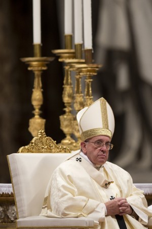 Pope Francis celebrates Mass on the occasion of the feast of Our Lady of Guadalupe in St. Peter's Basilica at the Vatican, Friday, Dec. 12, 2014.    Artisans tasked to craft the papal chairs during his visit to the Philippines in January are making sure the finished products will suit his taste for simplicity.  AP Photo/Andrew Medichini 