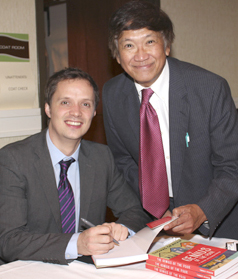 Thomas Graham autographs a copy of his book for PINOY publisher Mariano (Anong) Santos. PINOY PHOTO