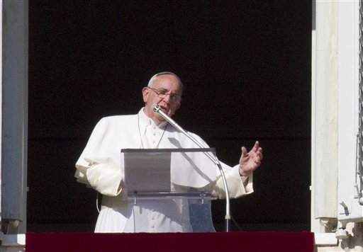 Pope Francis speaks during the Angelus noon prayer from his studio window overlooking St. Peter's square at the Vatican on Sunday, Jan. 4, 2015. Dagupan Archbishop Socrates Villegas is urging the faithful in his archdiocese to storm heaven with prayers for the safety of Pope Francis, who will visit the Philippines from Jan. 15 to 19 without bodyguards and bulletproof vehicles.  AP PHOTO/RICCARDO DE LUCA  