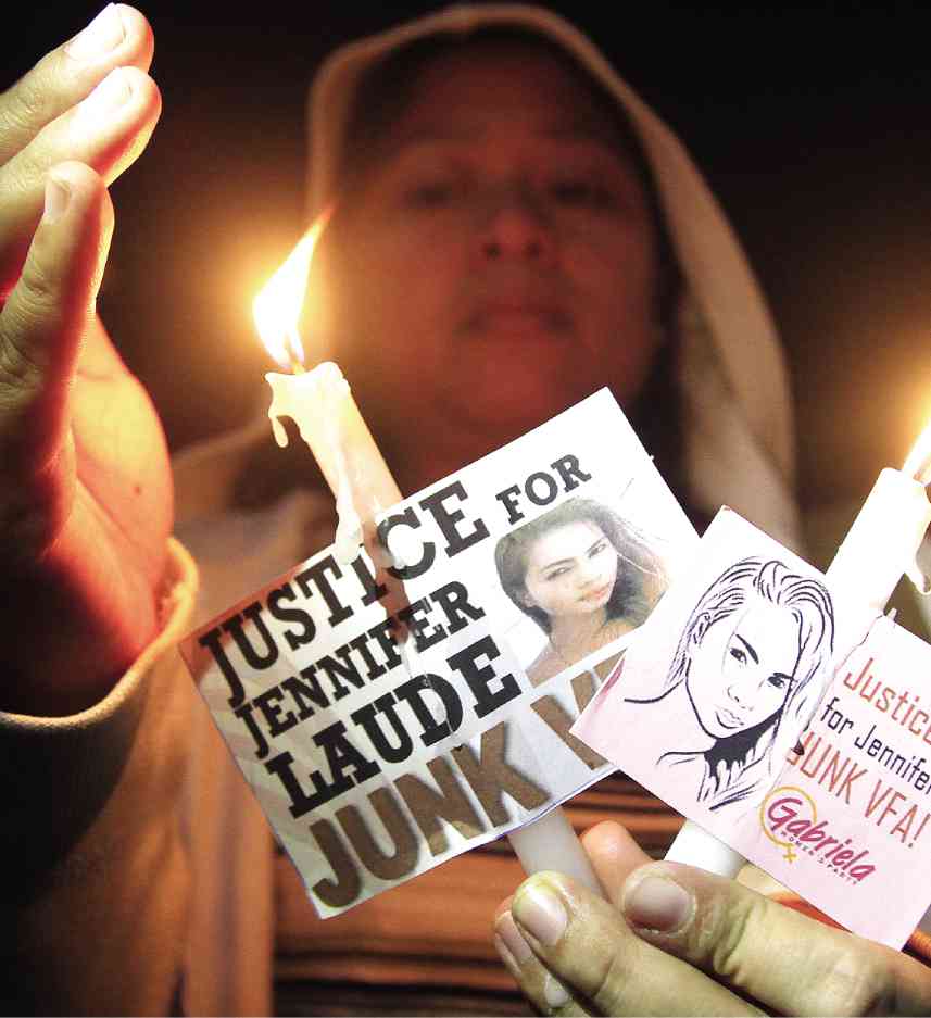 MEMBERS of the militant women’s group Gabriela light candles at a protest rally on Oct. 17, 2014, demanding Philippine custody of American soldier Joseph Scott Pemberton, who is facing a murder case for the killing of Filipino transgender Jennifer Laude. MARIANNE BERMUDEZ 