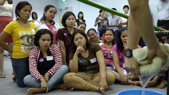 Maids attend a one-day compulsory Settling-In-Program course in 2012, which teaches first-time maids how to work safely and adjust to life in Singapore. The Straits Times/Asia News Network