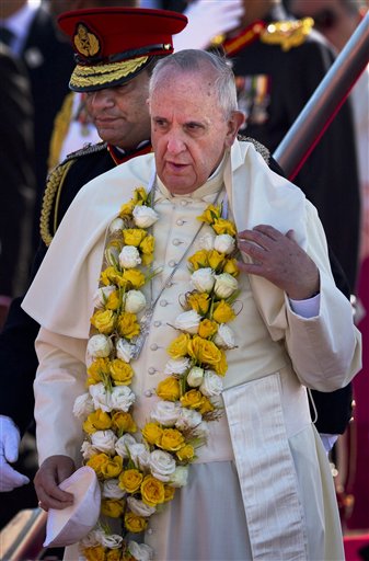 Pope Francis stands on the tarmac of the airport upon arrival in Colombo, Sri Lanka, Tuesday, Jan. 13, 2015.  AP
