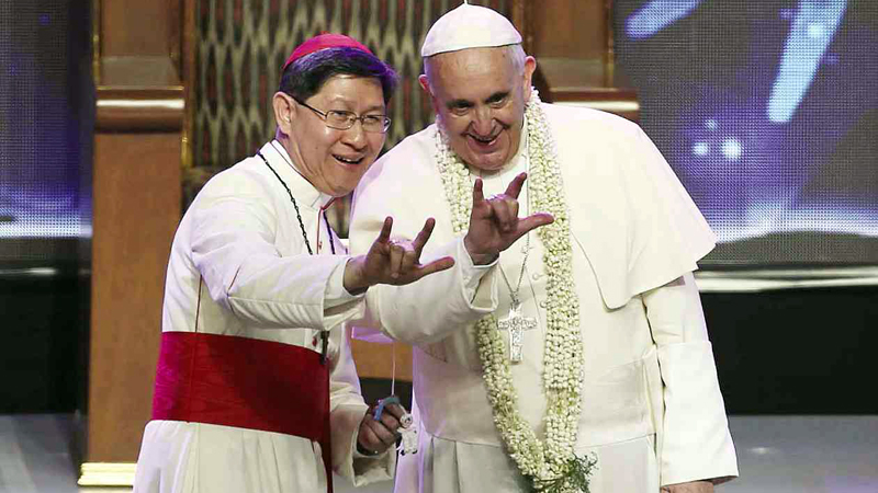Manila Archbishop Luis Antonio Cardinal Tagle and Pope Francis. FILE PHOTO