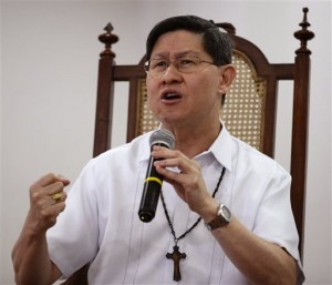 In this Jan. 10, 2015 photo, Manila Archbishop Cardinal Luis Antonio Tagle talks about the forthcoming visit of Pope Francis during a forum with students in Manila, Philippines. Pope Francis will be welcomed in the Catholic heartland on Thursday, Jan. 15, 2015, by the Filipino cardinal who might one day succeed him: a boyish-looking priest who rode the bus as a bishop and has impressed many with a humble life, intellect and compassion for the poor. (AP Photo/Bullit Marquez)