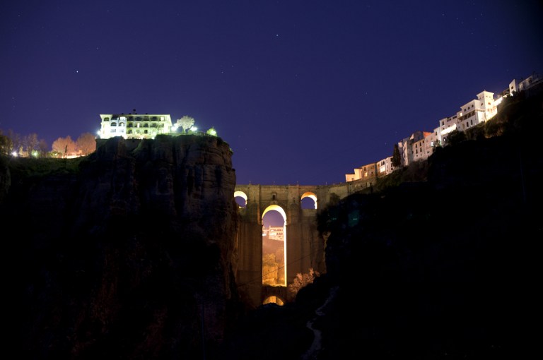 The New Bridge of Ronda is enlightened from behind during the global climate change awareness campaign "Earth Hour", on March 28, 2015. Millions are expected to take part around the world in the annual event organised by environment conservation group WWF, with hundreds of well-known sights including the Eiffel Tower in Paris and the Seattle Space Needle set to plunge into darkness for an hour to highlight the plight of the planet.   AFP