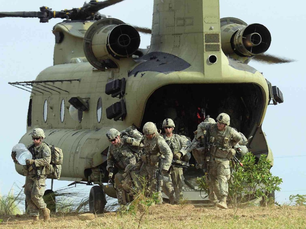 LET THE WAR GAMES BEGIN  US soldiers disembark from a Chinook helicopter during an air assault exercise with their Filipino counterparts in Fort Magsaysay, Nueva Ecija province, at the start of the joint US-Philippines annual military exercises. AFP PHOTO