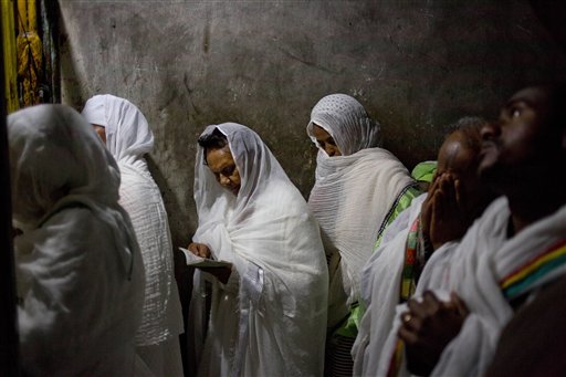 Ethiopian Orthodox Christian women pray at Deir El Sultan outside the Church of the Holy Sepulcher, traditionally believed by many to be the site of the crucifixion and burial of Jesus Christ, during Orthodox Palm Sunday, in Jerusalem, Sunday, April 5, 2015. Christians in the Holy Land and across the world are celebrating Easter, commemorating the day followers believe Jesus was resurrected in Jerusalem 2,000 years ago.  AP 